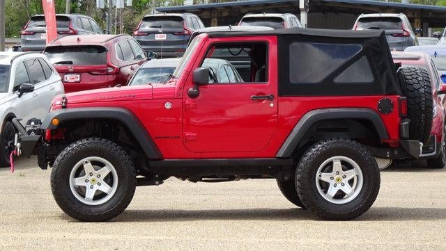 2013 Jeep Wrangler Rubicon in Red — front three-quarter view