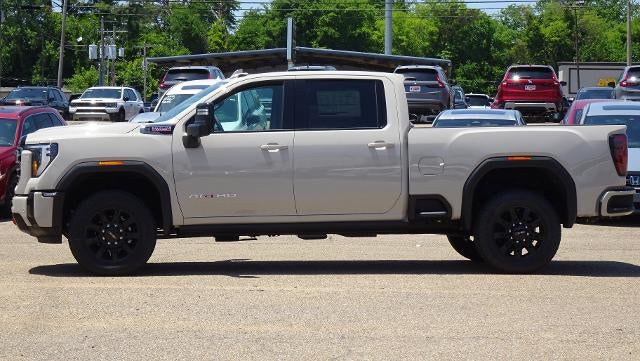 2026 GMC Sierra 2500 HD AT4 in Coastal Dune — front three-quarter view