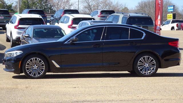 2019 BMW 5 Series Sedan in Black — front three-quarter view